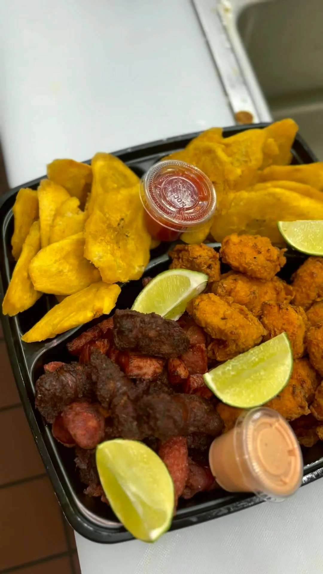 Picadera tray with tostones and longaniza